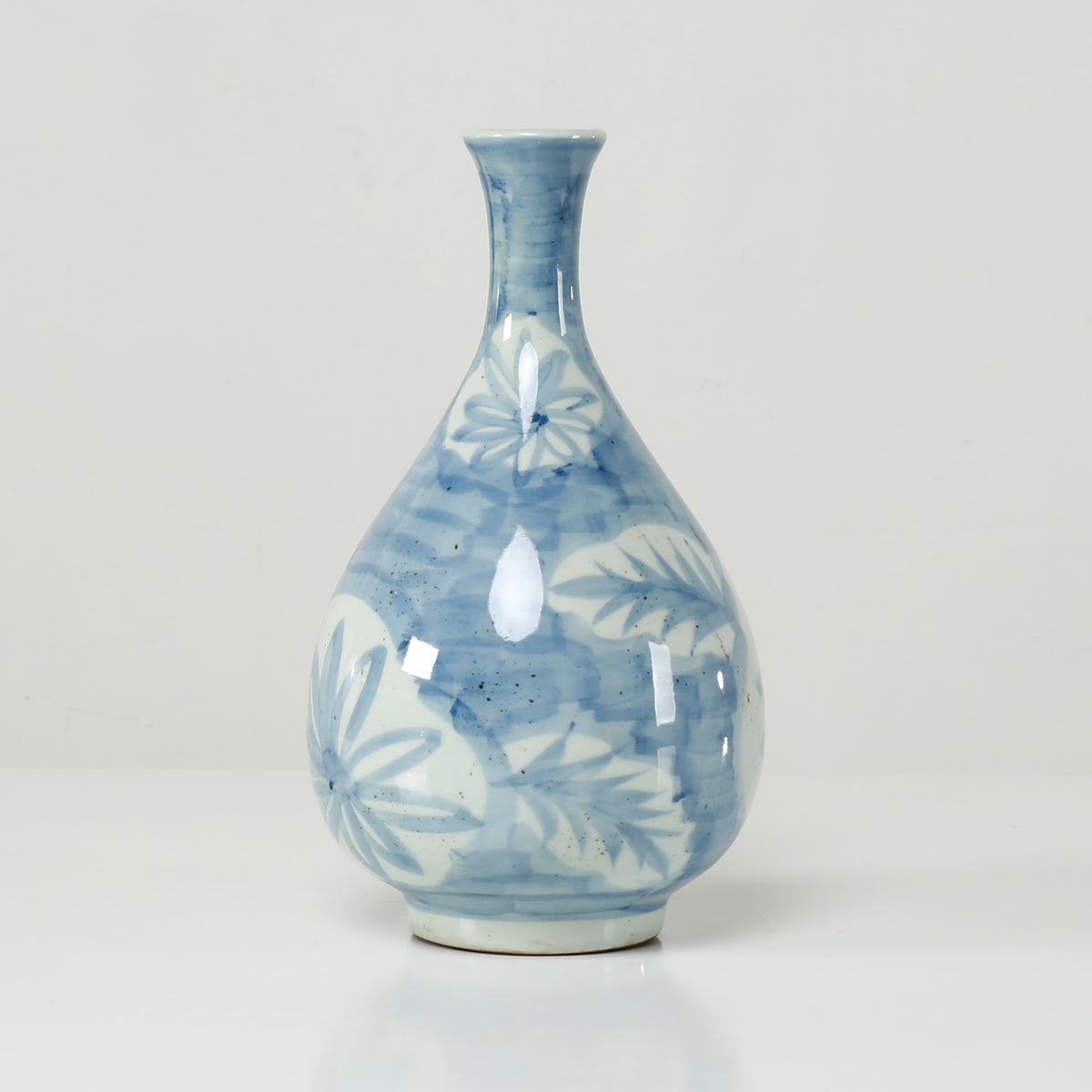 13" High Blue and White Decorative Vase with Floral and Leaf Motif