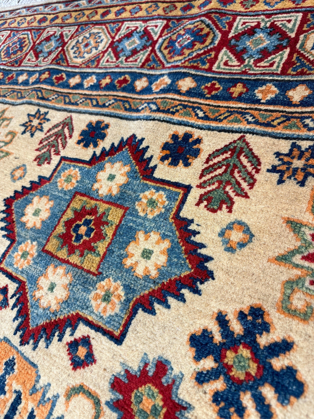 Afghan Kazak Medallion Rug 5x7 | Ivory, Red, Navy & Light Blue | Hand-Knotted Wool - Rugistan, view 3