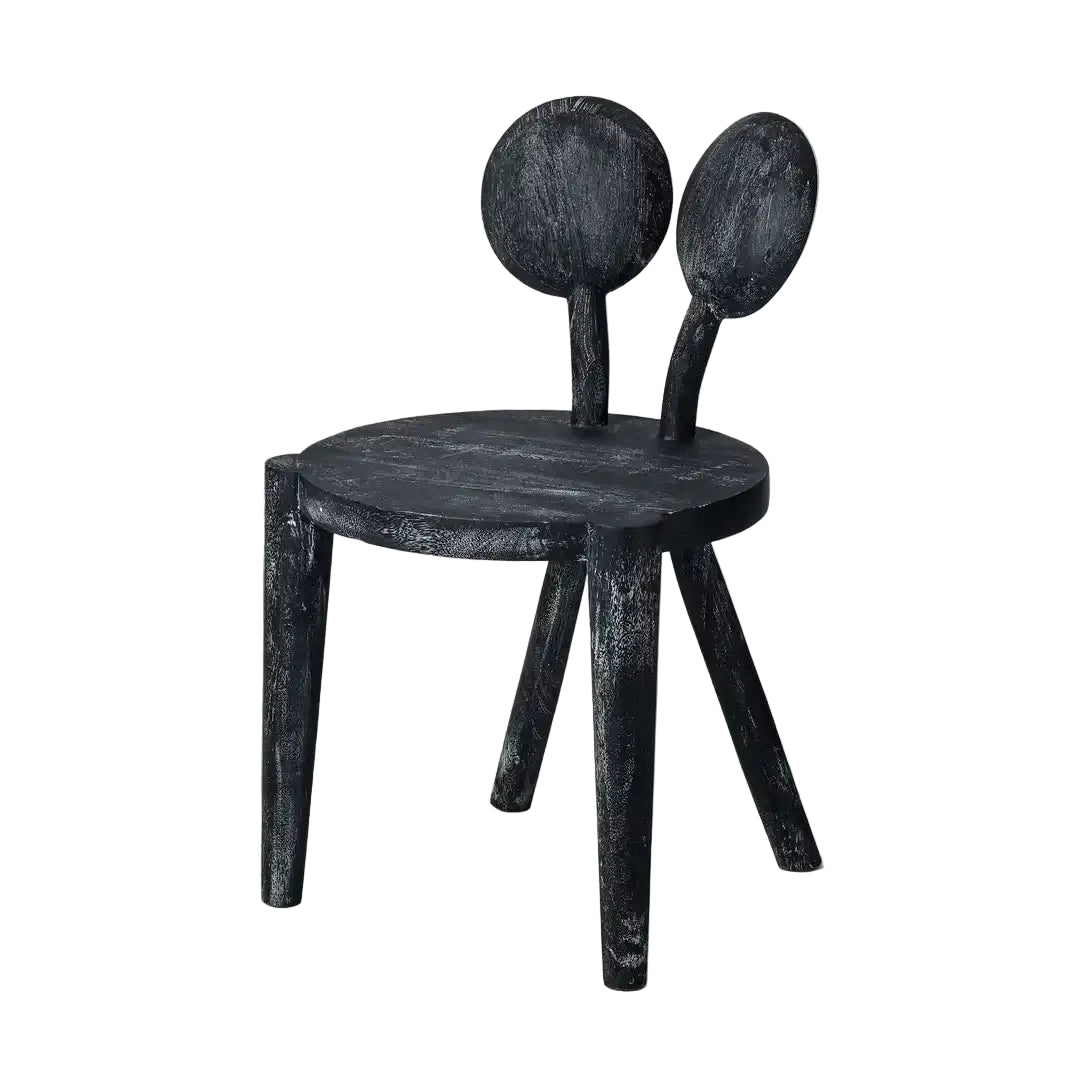 Black wooden chair with unique design on a plain background