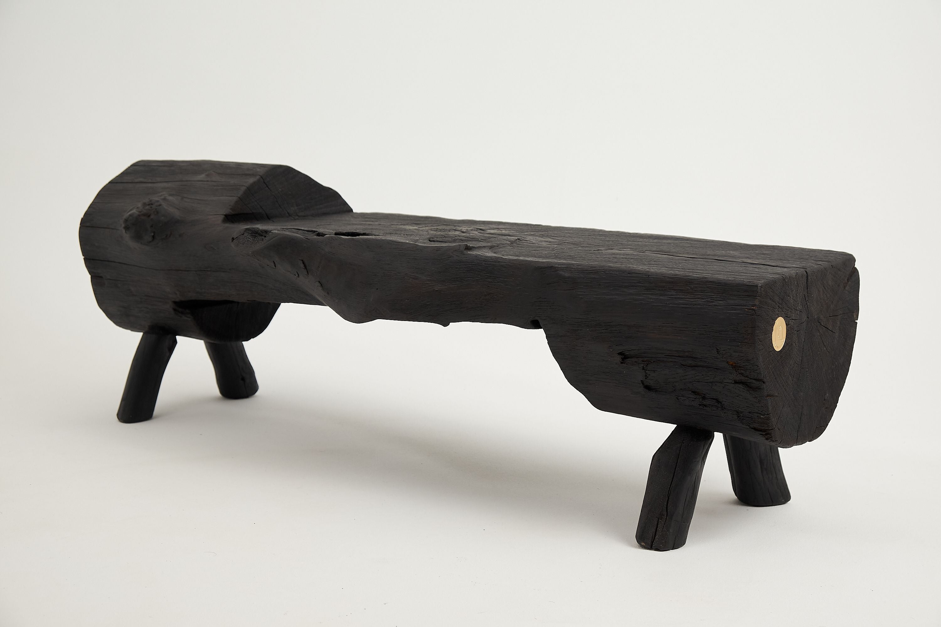 Jownik, Charred Wood Log Bench  Primitive Elegance in Burnt Timber
