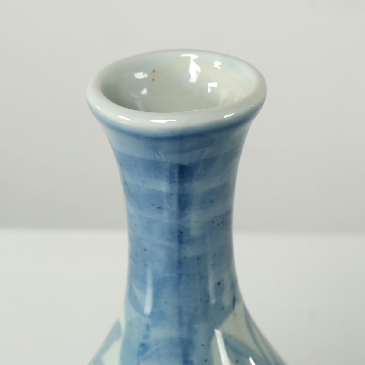 13" High Blue and White Decorative Vase with Floral and Leaf Motif