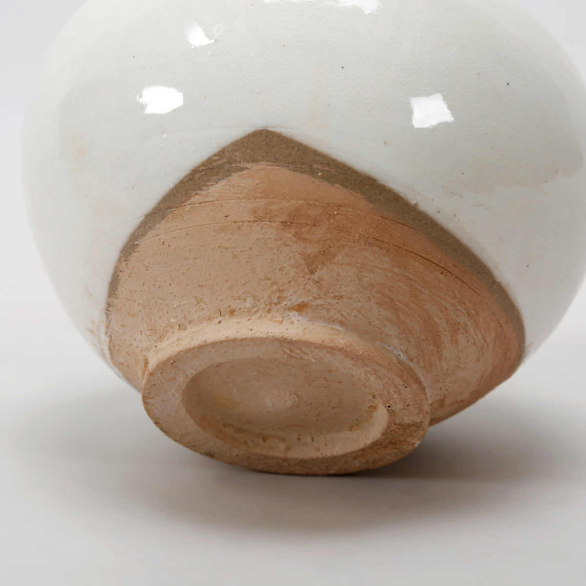 Approx. 6" H Off White Ceramic Pot with Unglazed Base