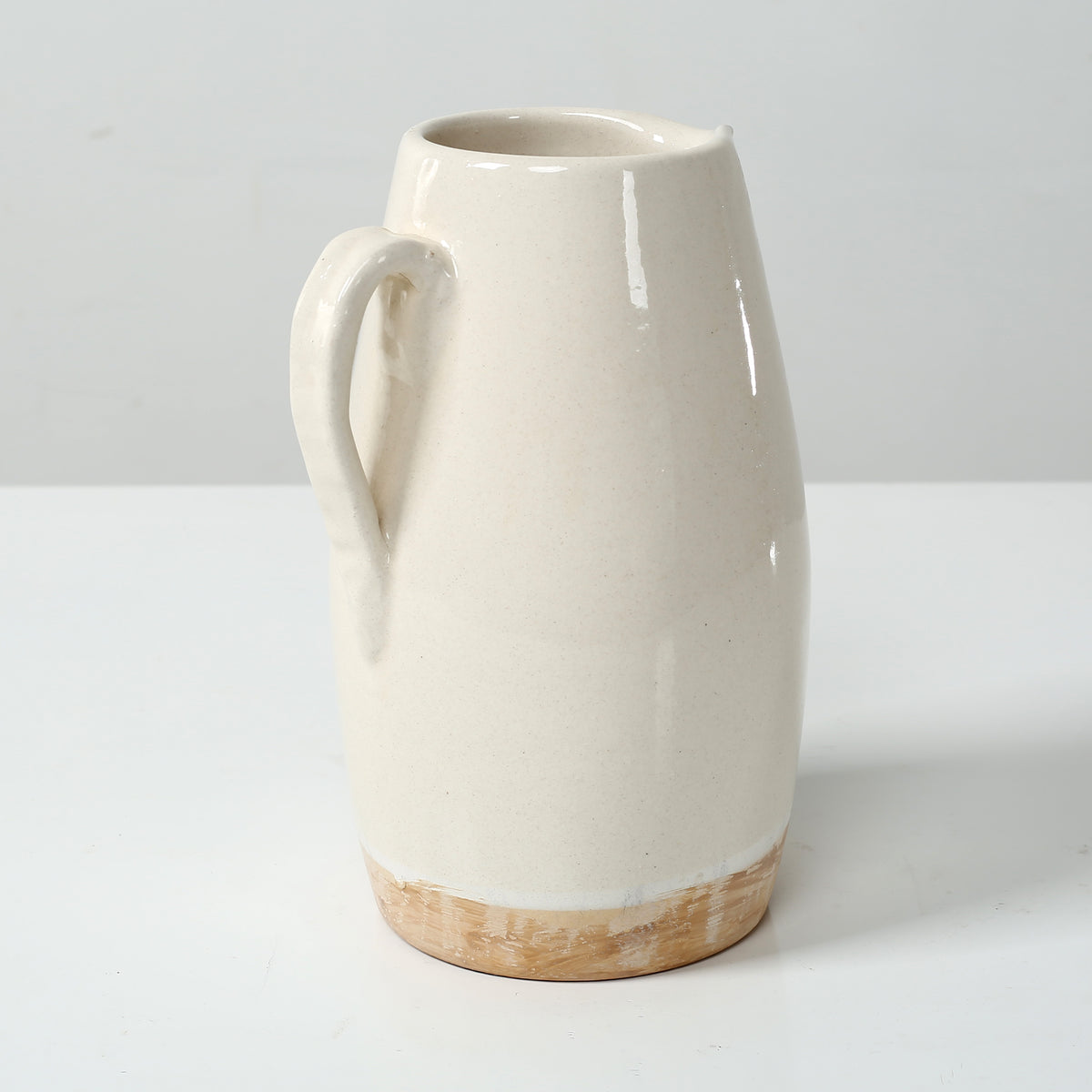 Approx. 9" High Off Whtie Ceramic Pitcher