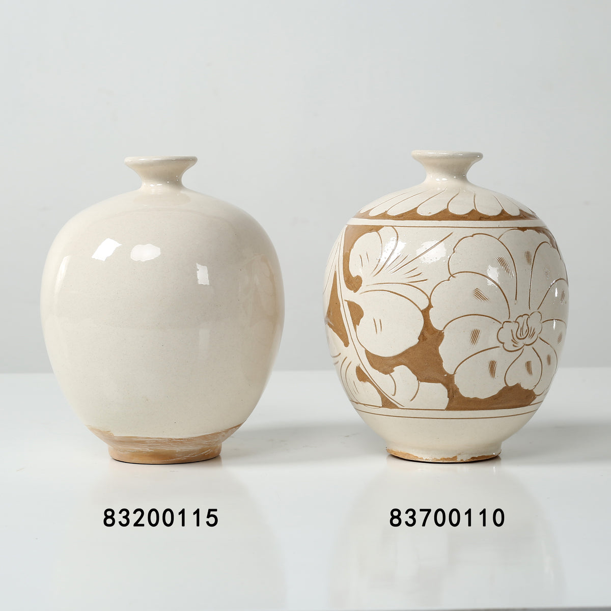 Approx. 8" High Off Whtie Ceramic Round Vase with Small opening