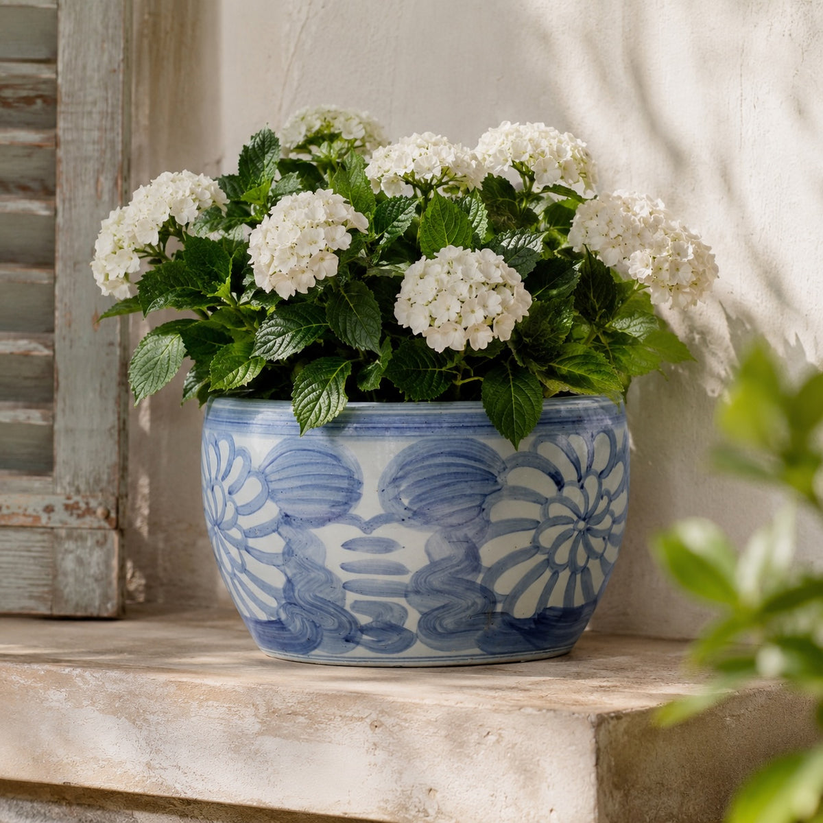 Approx. 14" Wide Blue and White Planter with Flower Motif