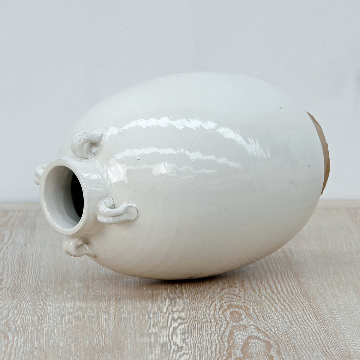 12" Off White Ceramic Pot with Four Handles Unglazed Base