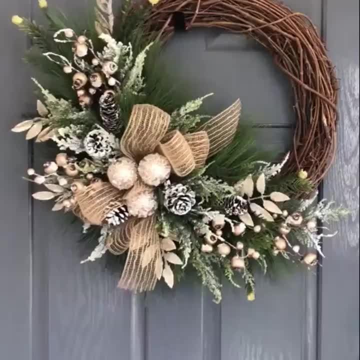 Plastic Christmas Wreath with Golden Accents and Pine Cones
