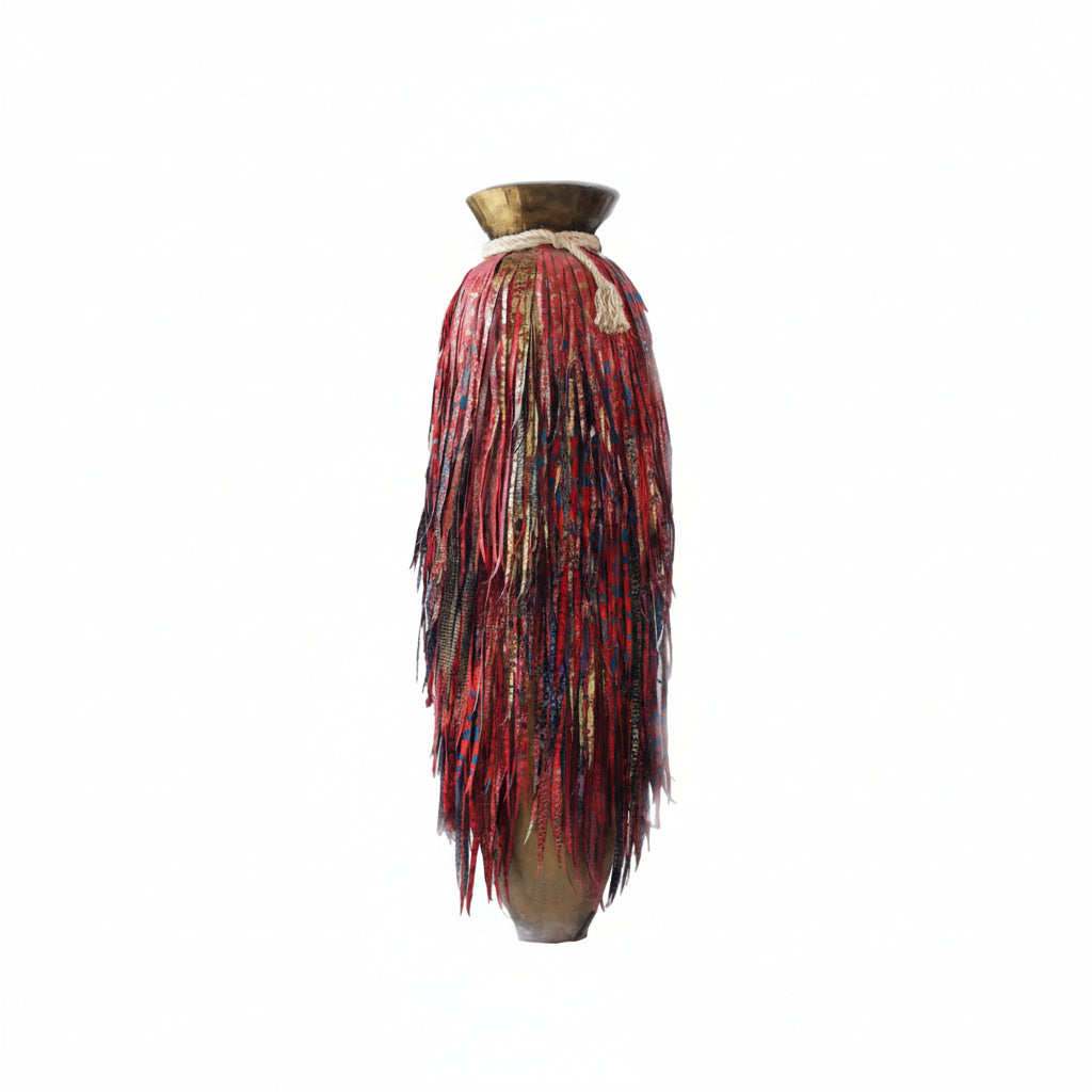 Modern interior with a staircase and decorative vase with red feathers.