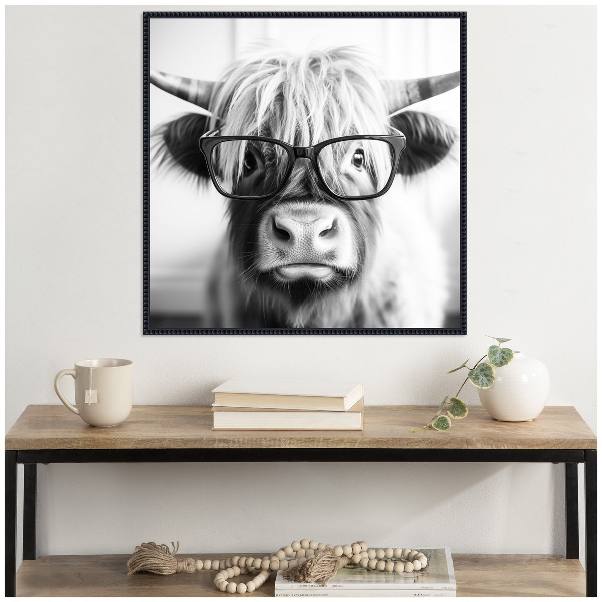 Sylvie Black and White Highland Cow in Reading Glasses Framed Canvas by The Creative Bunch Studio